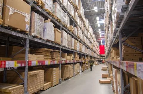 Rows of shelves with boxes in modern warehouse Stock-Fotos