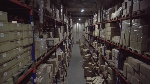 Rows of shelves inside an industrial warehouse with boxes. 스톡 동영상 252033033