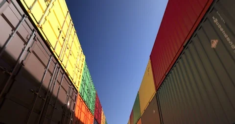 Rows of shipping containers under clear sky seamless loop Stock Footage 111568942