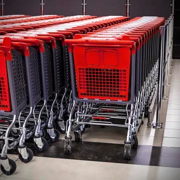 Rows of shopping carts in the store Stock Photos