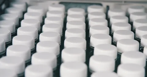 Rows of single use plastic HDPE bottle caps showing waste Stock Footage 102962761