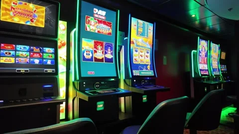 Rows of Slot Machines Inside a Dark Ferry Casino Stock-Footage 347684179