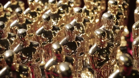 Rows of small golden oscar statue copies close up. Concept of awards, victory Video stock 255166914