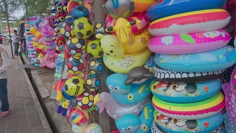 Rows of small shops at Pantai Teluk Kemang offer souvenirs and beach essentials. Stock Footage 308456425