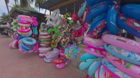 Rows of small shops at Pantai Teluk Kemang offer souvenirs and beach essentials. Stock Footage 308456514