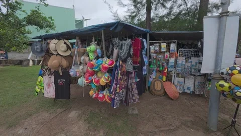 Rows of small shops at Pantai Teluk Kemang offer souvenirs and beach essentials. Stock Footage 308456521