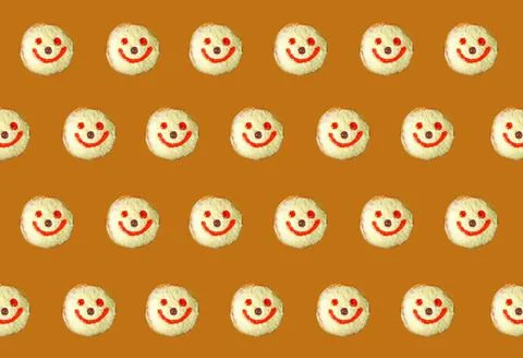 Rows of Smiling Face Coconut Flakes Jelly Donuts on Caramel Color Background Stock Photos