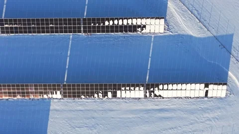 Rows of Snow Covered Solar Panels and Renewable Energy Stock Footage 328712045