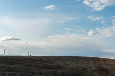 Rows of soil before planting. Drawing of furrows on a plowed field prepared.. Stock Photos