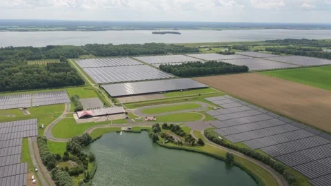 Rows of solar modules across countryside, utility scale, Netherlands Stock Footage 315850571