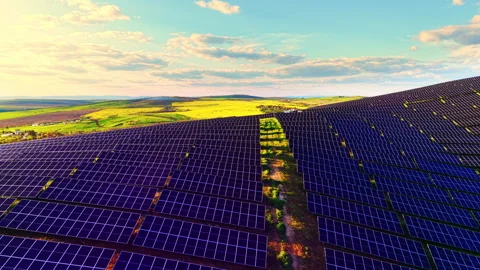 Rows of solar panels curve across hilltop at dusk, Bulgaria Видео 345152597