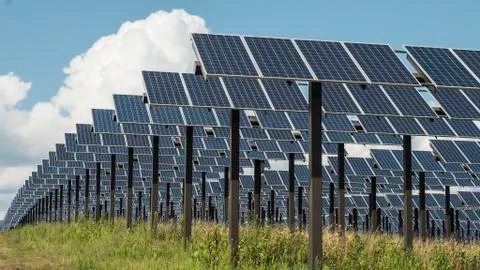 Rows of Solar Panels in daylight sun Stock Photos