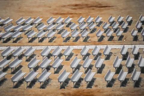 Rows of solar panels in dry field Stock Photos