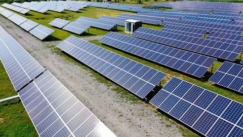 Rows of solar panels. Flight over photovoltaic power plant on the field. Stock Footage 119537903