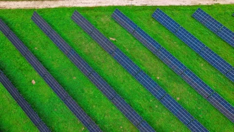 Rows of solar panels on green grass in Latvia Stock Footage 319556096