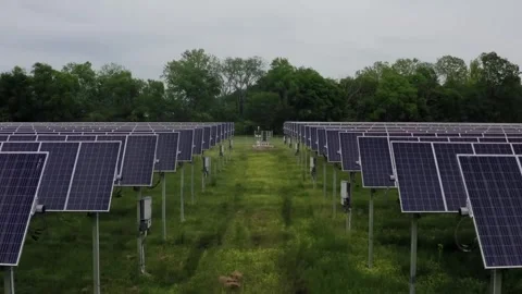 Rows of Solar Panels in Green Solar Farm Stock Footage 328392779