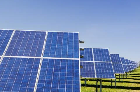 Rows of solar panels in small solar power plant Stock Photos