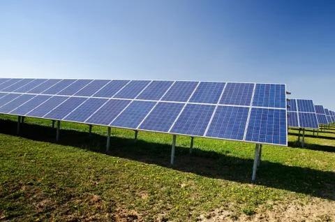 Rows of solar panels in small solar power plant Stock Photos