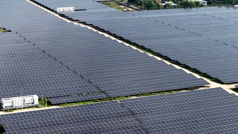 Rows of solar panels stretch across the landscape Stock Footage 338002180