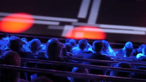 Rows of spectators in the ancestor of the upcoming event. Large stadium with Stock Footage 150368391