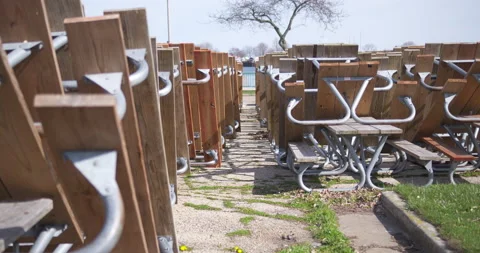 Rows of Stacked Picnic Tables 4K 23.98 Truck Left then Right Stock Footage 133380960