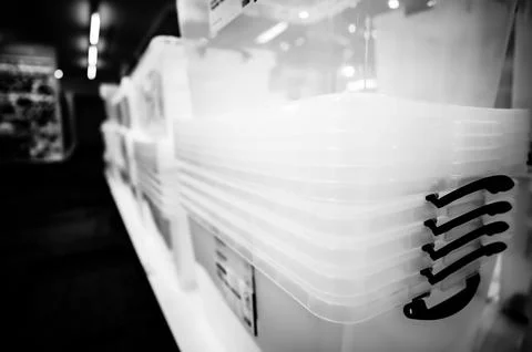 Rows of stacked plastic containers for organization and storage. Stock Photos