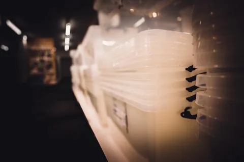 Rows of stacked plastic containers for organization and storage. Stock Photos