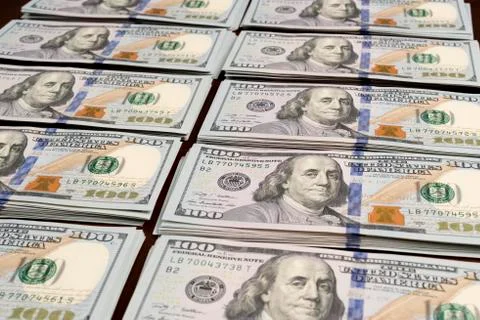 Rows stacks of dollars on table Stock Photos