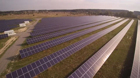 Rows of sun panels built at electrical substation in field 스톡 동영상 169855434