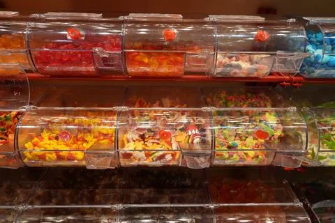 Rows of sweets in shop Фото
