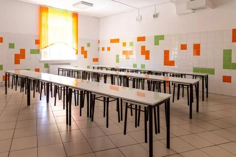 Rows of table in modern school cafeteria or canteen interior. Factory cante.. Stock Photos