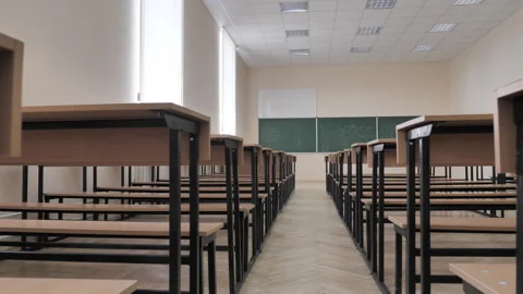 Rows Of Tables And Chalkboard In Empty Lecture Hall, Classroom. Slider View Stock Footage 287992684