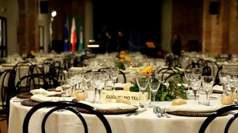 Rows of tables set for dinner or lunch. Video stock 23536349