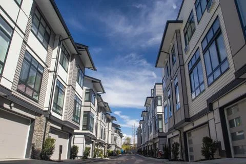 Rows of townhomes side by side. External facade of a row of colorful modern u Stock Photos