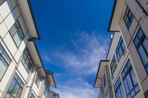 Rows of townhomes side by side. External facade of a row of colorful modern u Stock Photos