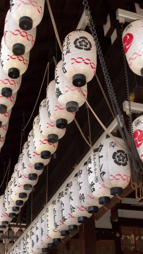 Rows of Traditional Japanese Paper Lanterns Hanging at Kyoto Shrine Stock Footage 337520896