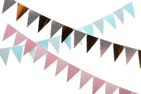 Rows of triangular bunting flags on white background. Festive decor 스톡 사진