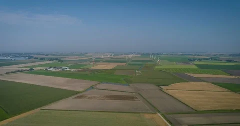 Rows of Turbines on a Wind Farm, Fields, Barradeel, The Netherlands – 4K Drone Stock Footage 124528910