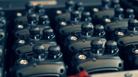 Rows of two-way radios are in the special charging device Stock Footage 68370714