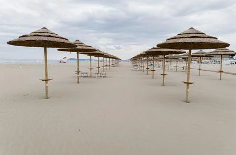 Rows of umbrellas on the beach Stock Photos