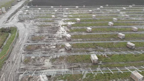 Rows of Unfinished solar panels, Assembling of solar power plant, Aerial Stock Footage 149591764