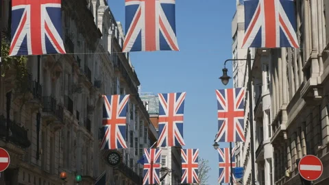 Rows of Union jacks hanging in an old street. Stock Footage 125946148