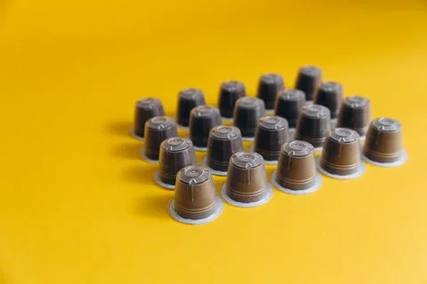 Rows of various coffee capsules Foto stock