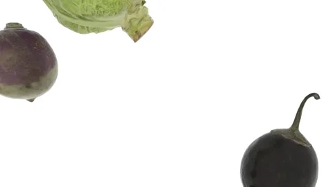 Rows of vegetables move diagonally across the white screen, leaving room for a Stock Footage 148289713