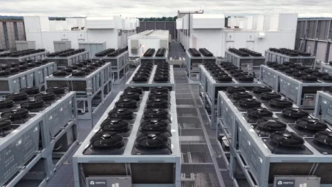 Rows of Vertiv cooling units cover data center rooftop in Clifton New Jersey Stock Footage 340322555