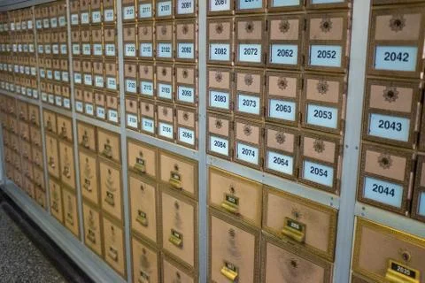 Rows of vintage post boxes of assorted sizes Foto stock