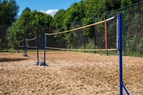 Rows of volleyball nets on empty sand court Stock Photos