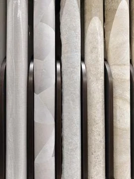 Rows of wallpaper rolls with subtle patterns and textures, perfect for crea.. Stockfoto's