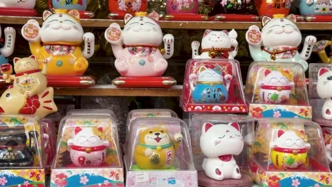 Rows of Waving Maneki Neko Lucky Cat Figurines in Manila Chinatown Stock Footage 332827822
