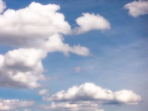 Rows of White Clouds Spread Across a Blue Daytime Sky Stock Photos